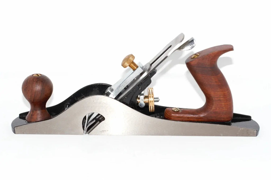 A Faithfull no 10 Rebate plane with a carbon steel blade,  wooden knobs, and brass adjustment screws, shown on a plain white background.