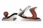 A Faithfull no 10 Rebate plane with a carbon steel blade,  wooden knobs, and brass adjustment screws, shown on a plain white background.