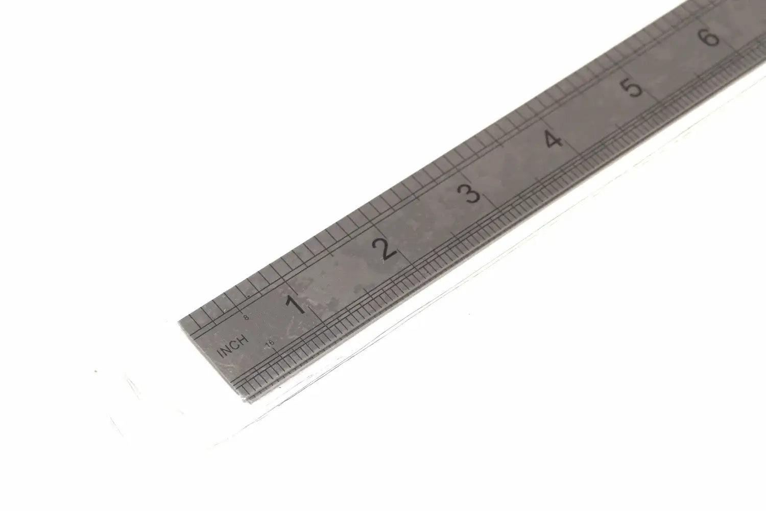 Fisher 300mm Stainless Steel Ruler showing dual-scale markings on a white background.