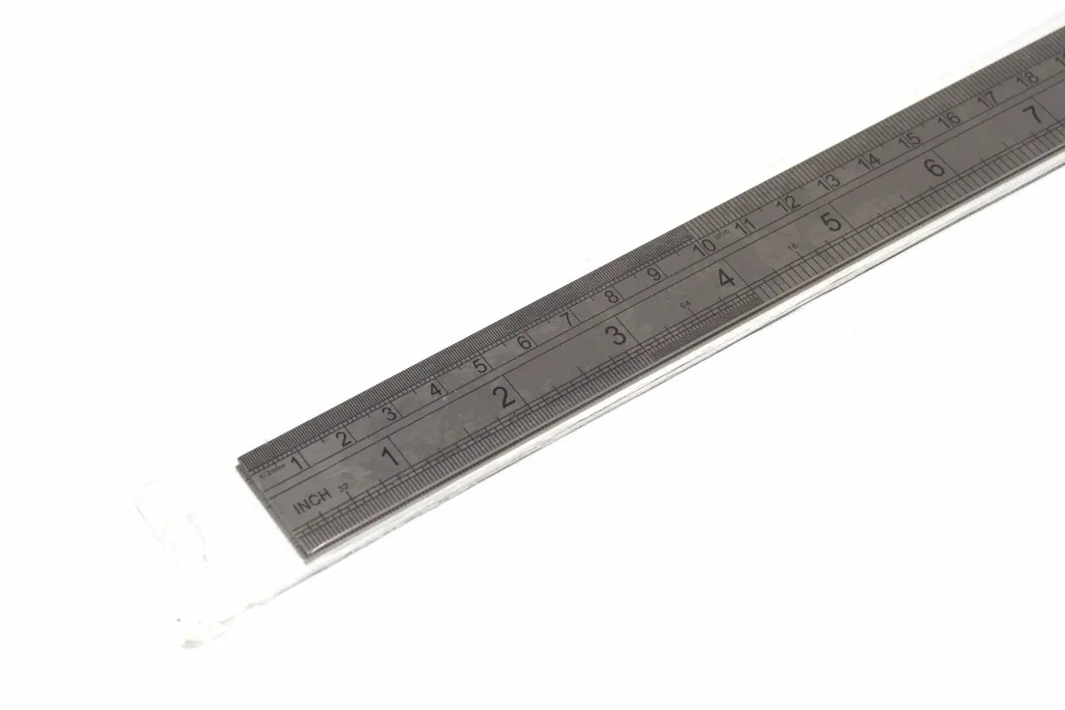 Fisher 300mm Stainless Steel Ruler laying on a white background, featuring dual-scale measurements in inches and centimeters.