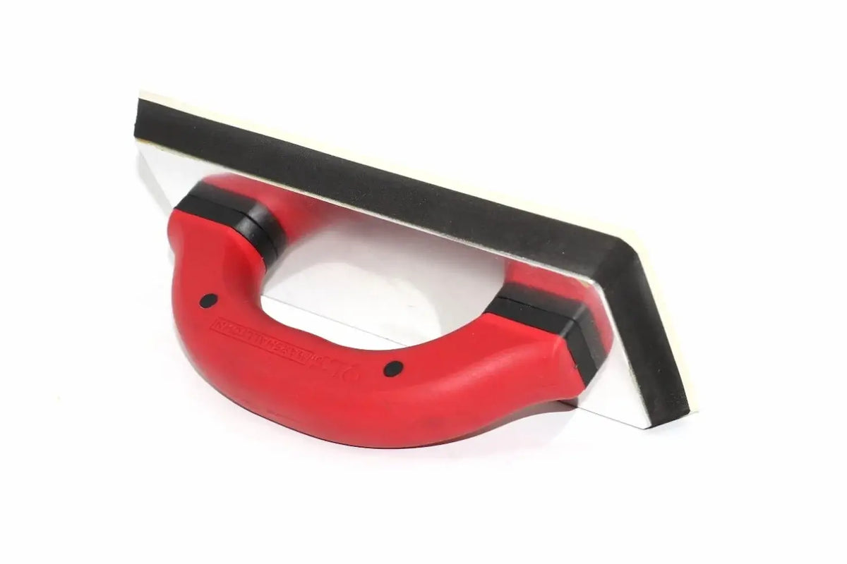 Marshalltown QLT grout float in red and black, from Cherry Tree Tools, with a durable rubber pad and steel backing.