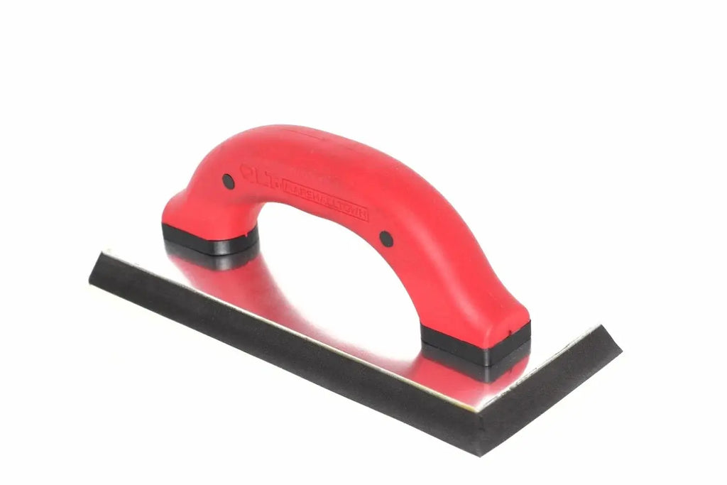 Marshalltown QLT grout float from Cherry Tree Tools in red and black with a durable rubber pad and tempered steel backing.