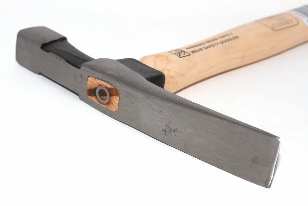 Spear & Jackson 25oz Bricklayers hammer close-up of a hammer head and part of its wooden handle on a plain white background.