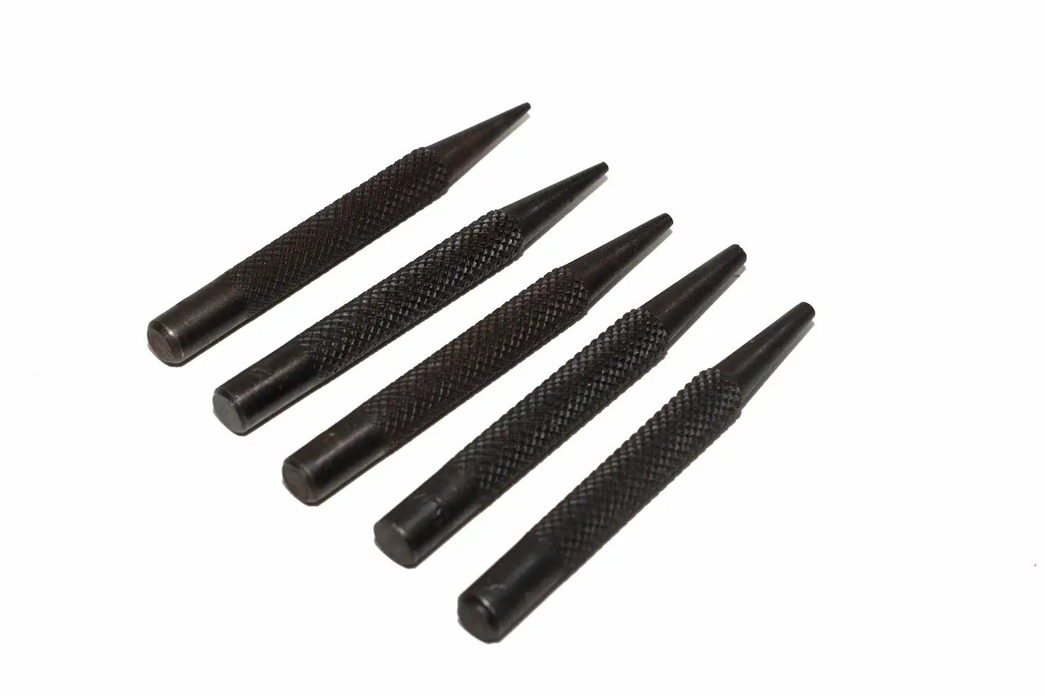Silverline 5pc nail punch set Five black metal punch tools with knurled textured handles, arranged diagonally on a plain white background.