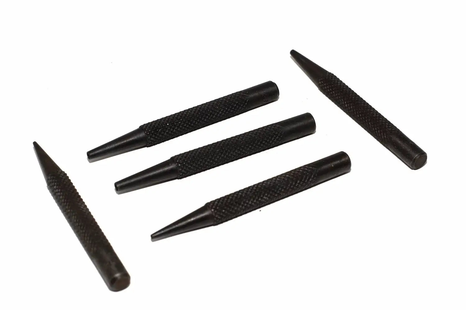 Silverline 5pc nail punch set Five black textured metal nail punches arranged diagonally on a plain white background.
