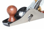 Faithfull no 10 rebate plane close up with a polished metal body, and a round  wooden knob, shown on a white background.