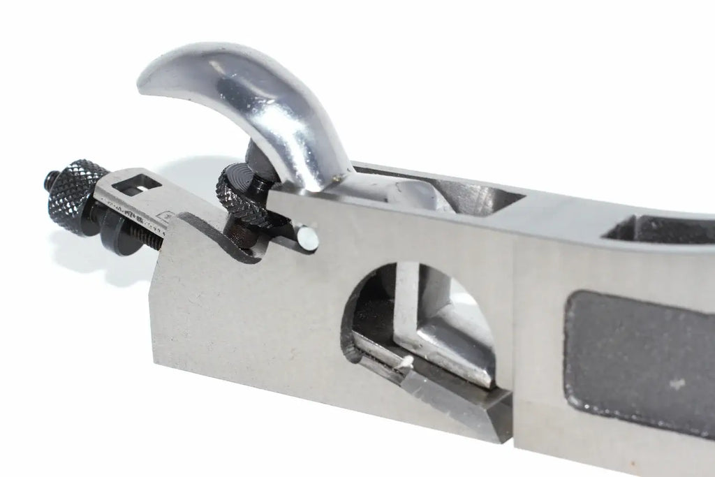 Faithfull 3 in 1 Shoulder Plane 27mm Close-up of a metabodied hand plane with a polished silver handle and adjustment knobs on a white background.